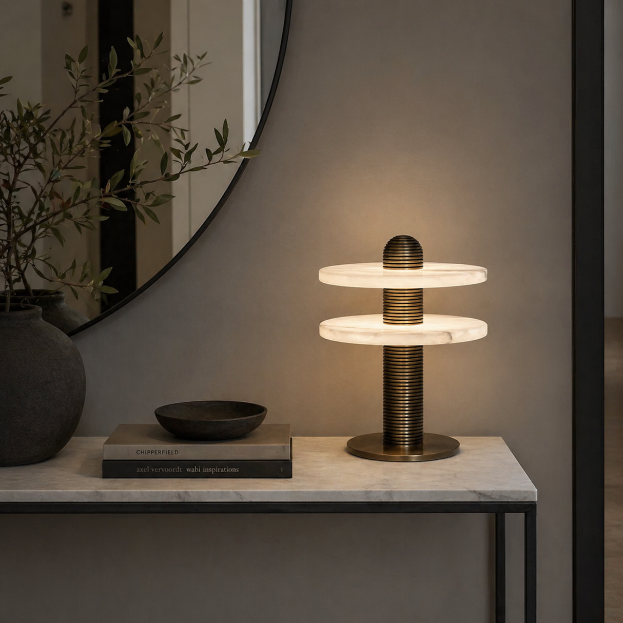 Modern table lamp on a marble surface with decorative items in a minimalistic setting.