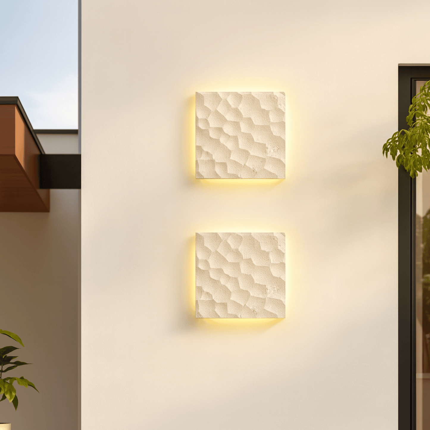Two square wall lights with textured finish on a light-colored wall.