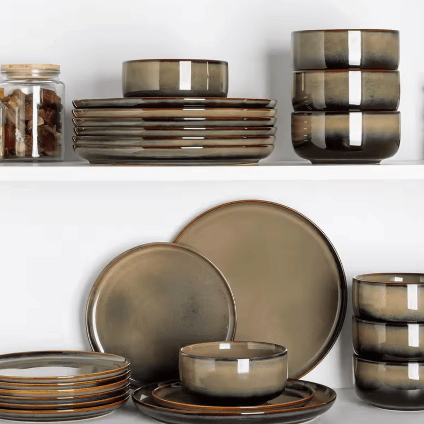 Set of brown ceramic dinnerware on a white background