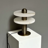 Modern lamp with marble-like design on a gray background