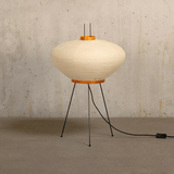 Modern floor lamp with ribbed design on a textured wall background