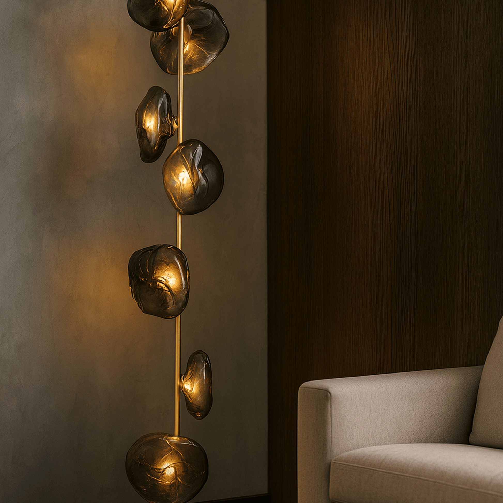 Decorative wall light fixture with gold accents in a room setting.