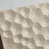 Close-up of textured stone surface with wavy pattern