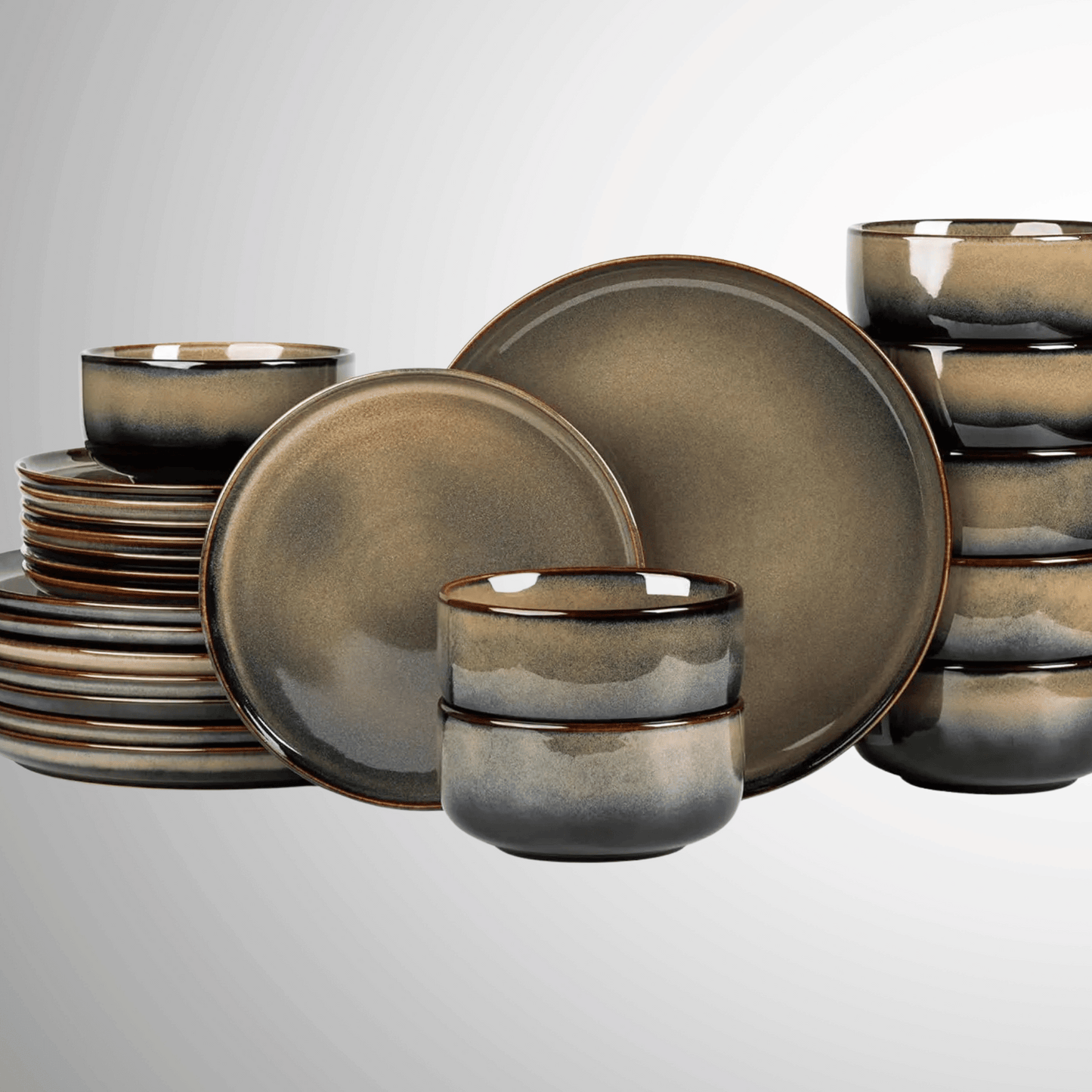 Set of ceramic dinnerware with a metallic finish on a light gray background
