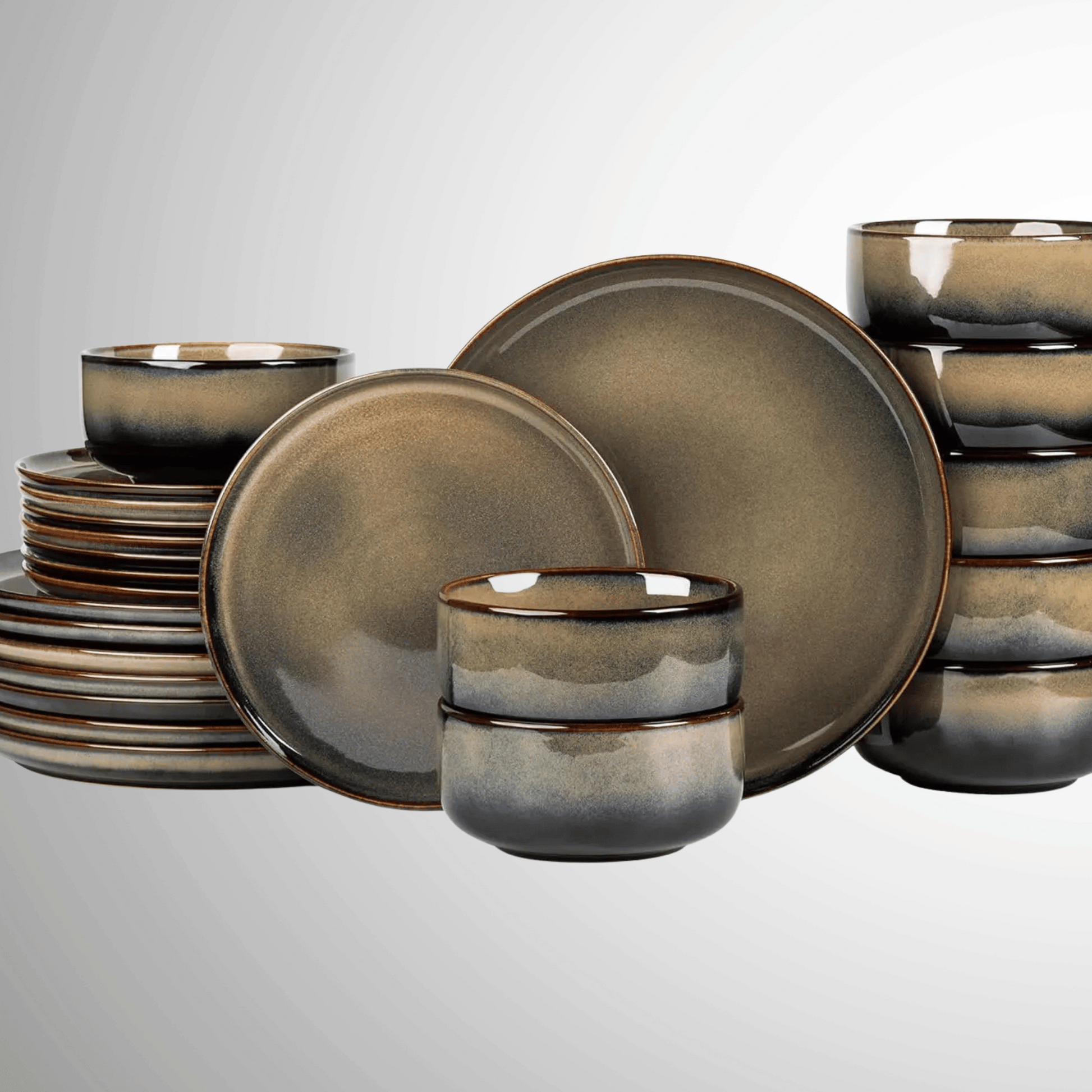 Set of ceramic dinnerware with a metallic finish on a light gray background