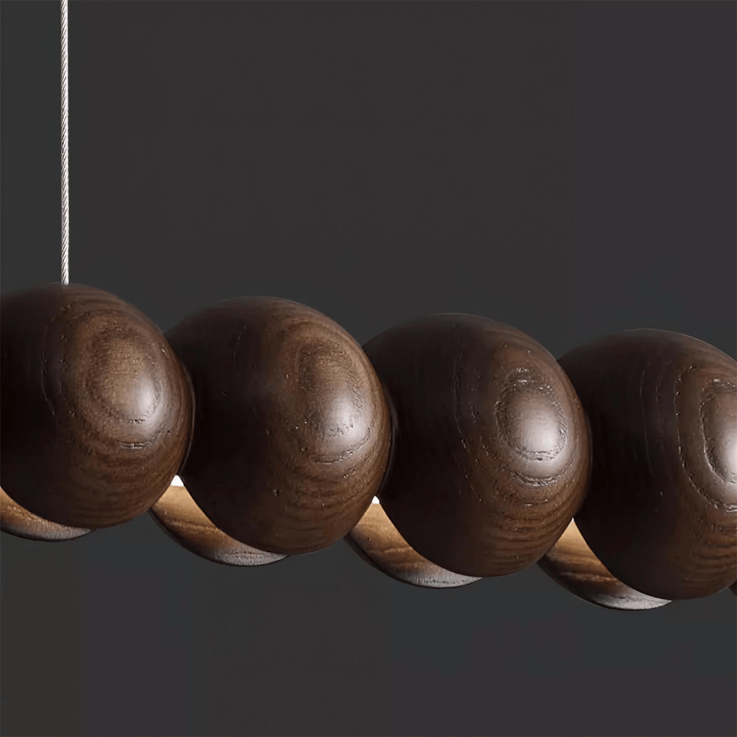 Close-up of a row of wooden beads on a dark background