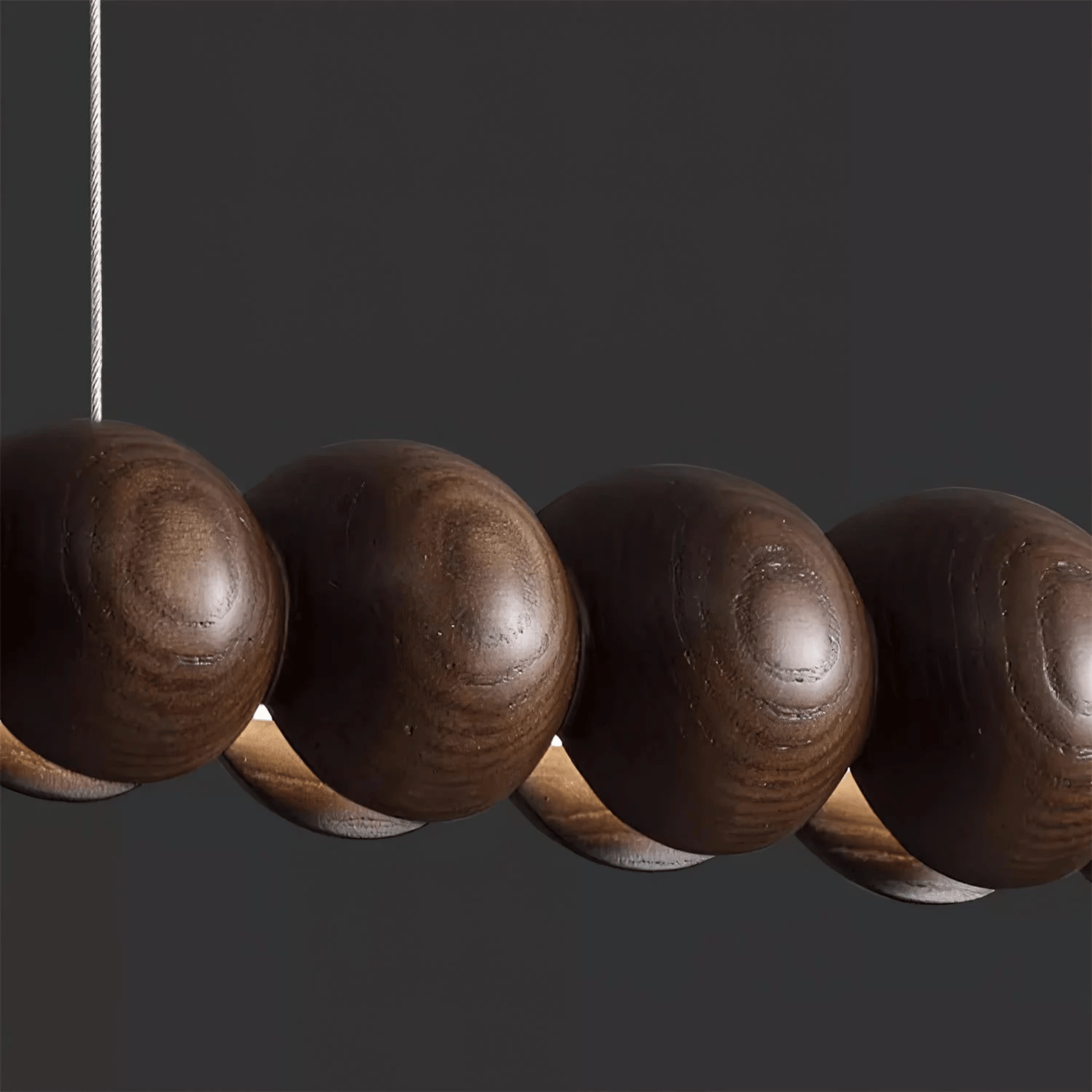 Close-up of a row of wooden beads on a dark background