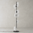 Modern floor lamp with white glass shades on a neutral background