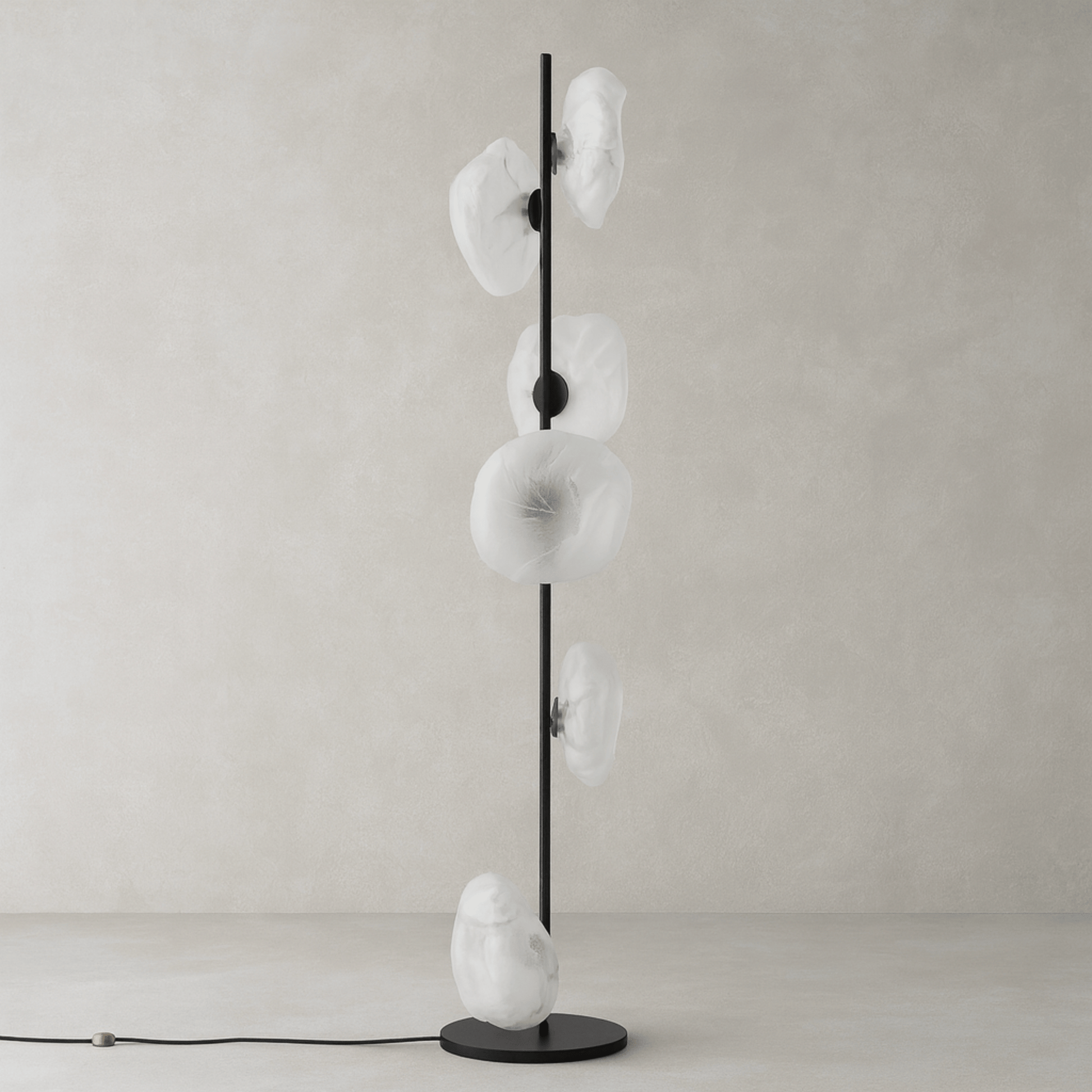 Modern floor lamp with white glass shades on a neutral background