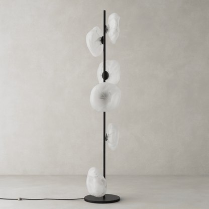 Modern floor lamp with white glass shades on a neutral background