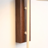 Wooden wall sconce with a light fixture on a white background