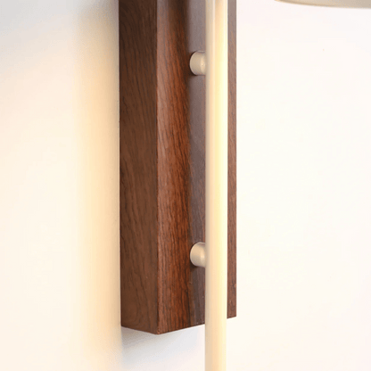 Wooden wall sconce with a light fixture on a white background