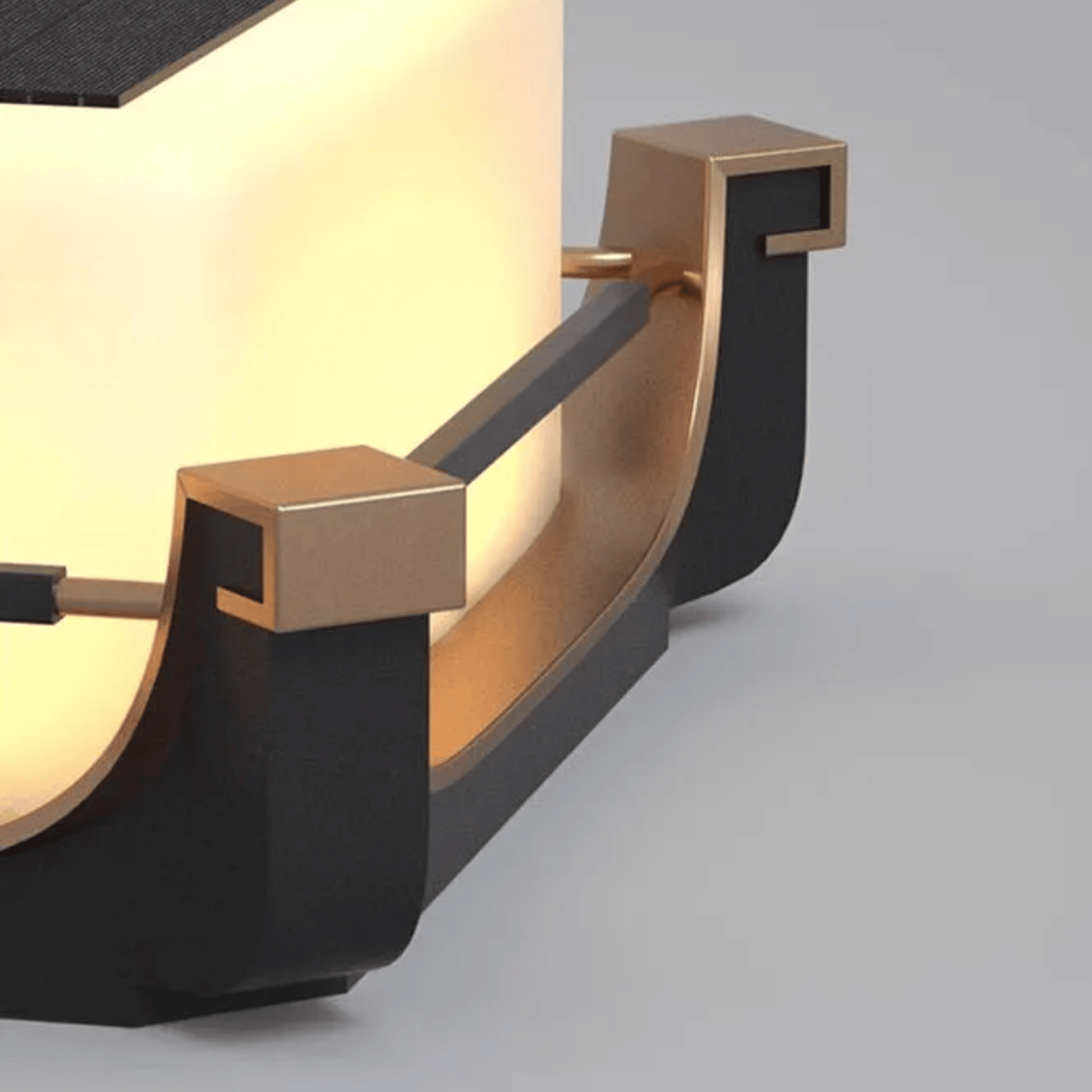 Modern wall sconce with black and gold finish on a gray background