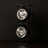 Modern floor lamp with two metallic light fixtures on a black background