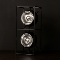 Modern floor lamp with two metallic light fixtures on a black background