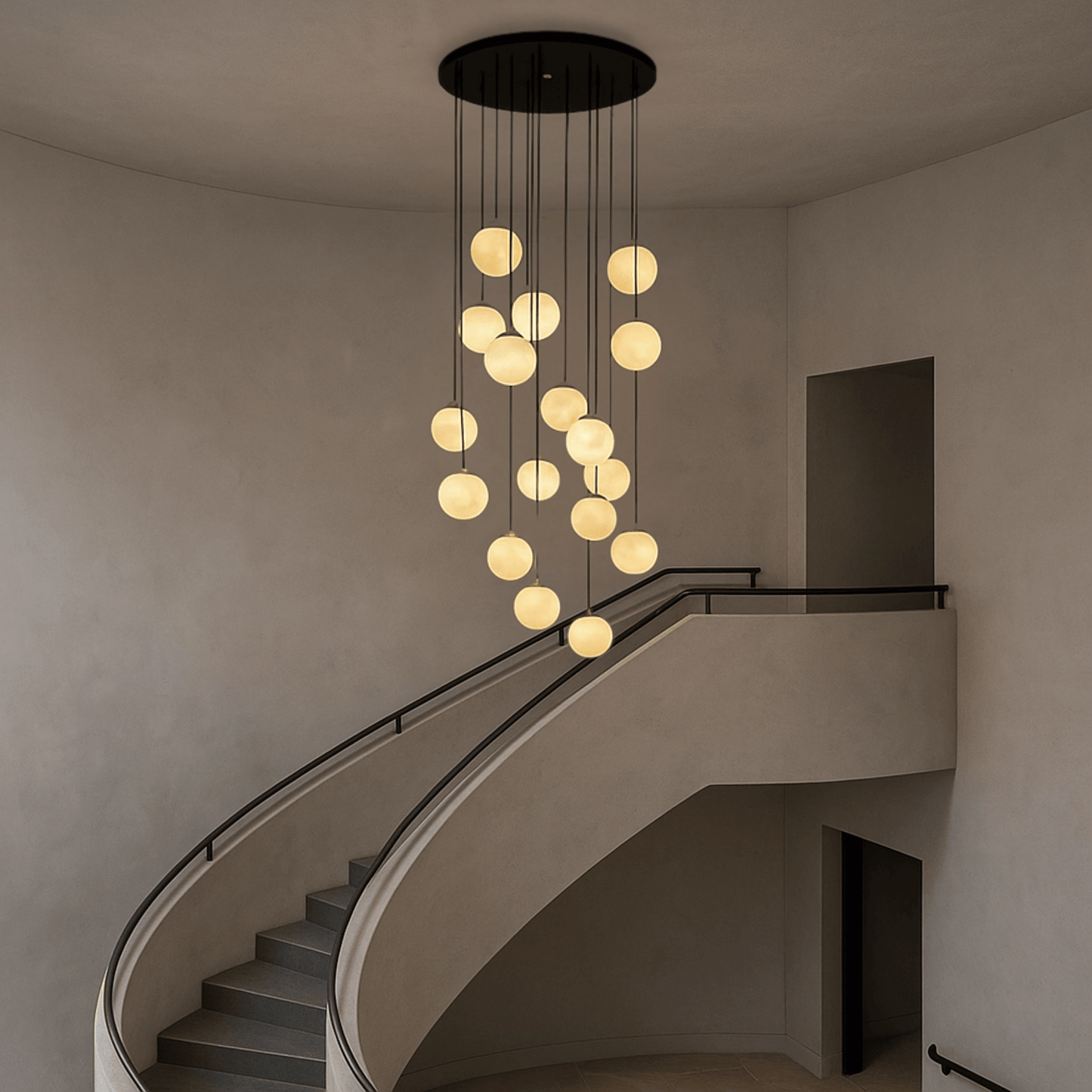 Modern chandelier hanging above a staircase in a minimalistic interior.