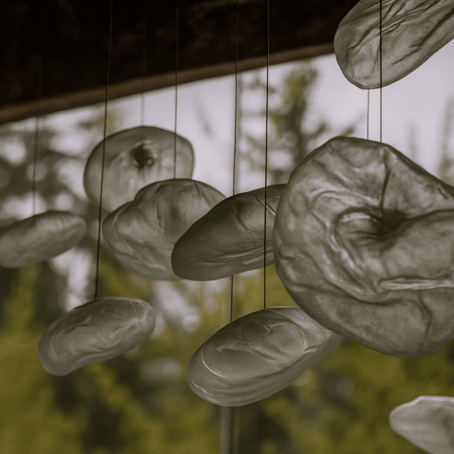 Decorative hanging stones with a blurred natural background