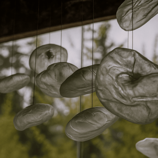 Decorative hanging stones with a blurred natural background