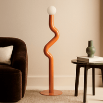 Modern floor lamp with wavy design in a living room setting.