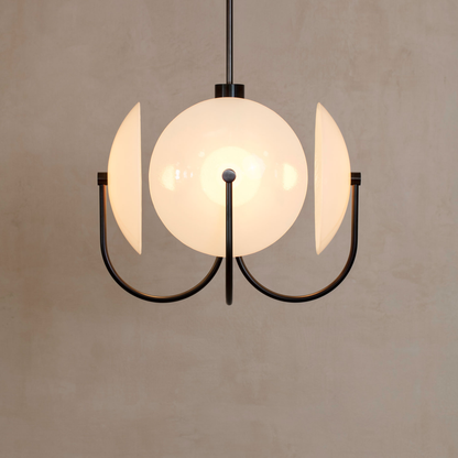 Modern pendant light with glass shades on a beige background