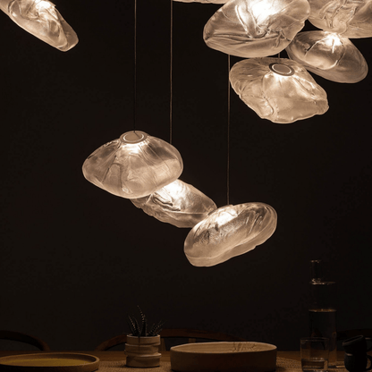 Decorative pendant lights with a warm glow against a dark background