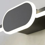 Sunglasses with a dark lens and white frame on a light gray background