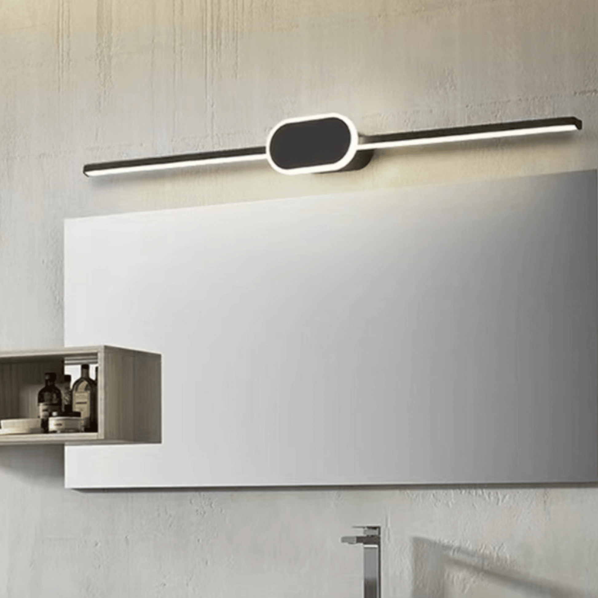 Modern wall-mounted light fixture above a mirror in a bathroom setting.