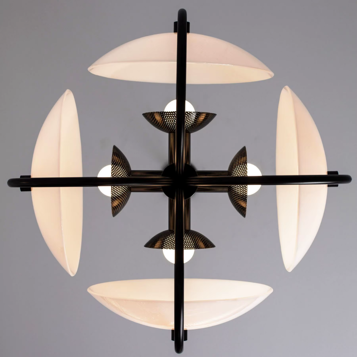 Modern chandelier with black metal frame and white glass shades on a gray background