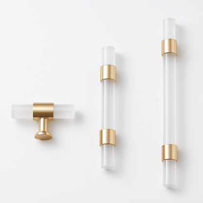 Set of three modern wall sconces with gold accents on a white background