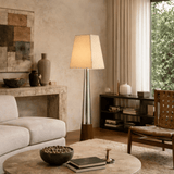 Modern living room with a lamp, sofa, and coffee table.