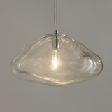 Clear glass pendant light on a gray background
