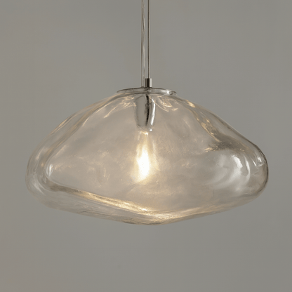 Clear glass pendant light on a gray background
