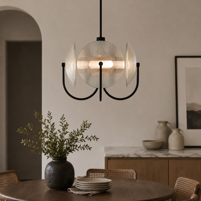 Modern pendant light fixture in a dining room setting with a neutral color palette.