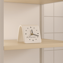 White clock with black hands and 'LENYVAEN' branding on a light wooden shelf.
