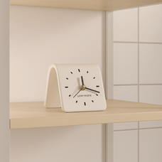 White clock with black hands and 'LENYVAEN' branding on a light wooden shelf.