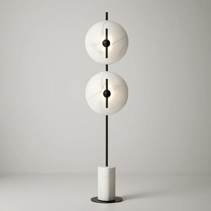 Modern floor lamp with two spherical white shades and a black central rod on a light gray background