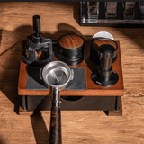 Coffee brewing tools on a wooden stand with a wooden surface background