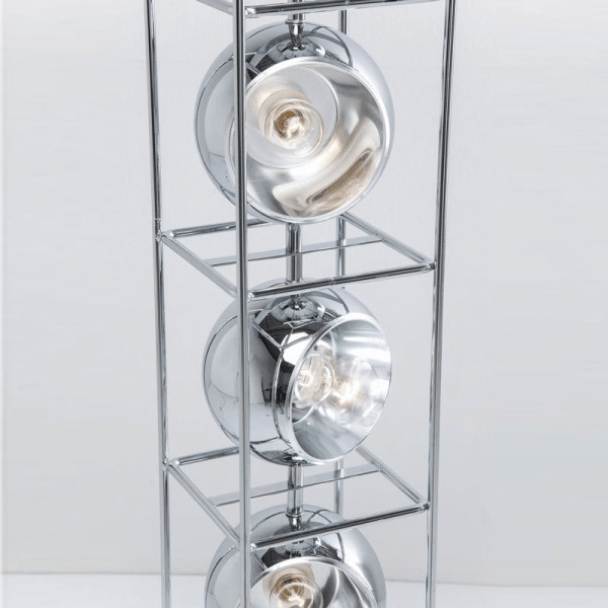 Chrome ceiling light fixture with three circular lights on a white background