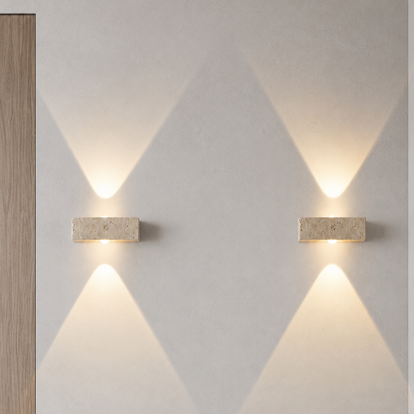 Two wall-mounted lights on a light gray wall with geometric patterns.