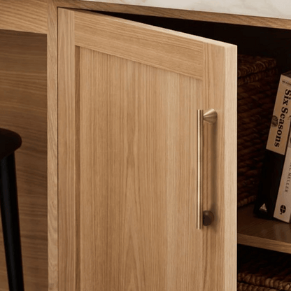 Wooden cabinet door with a handle, part of a larger wooden structure.