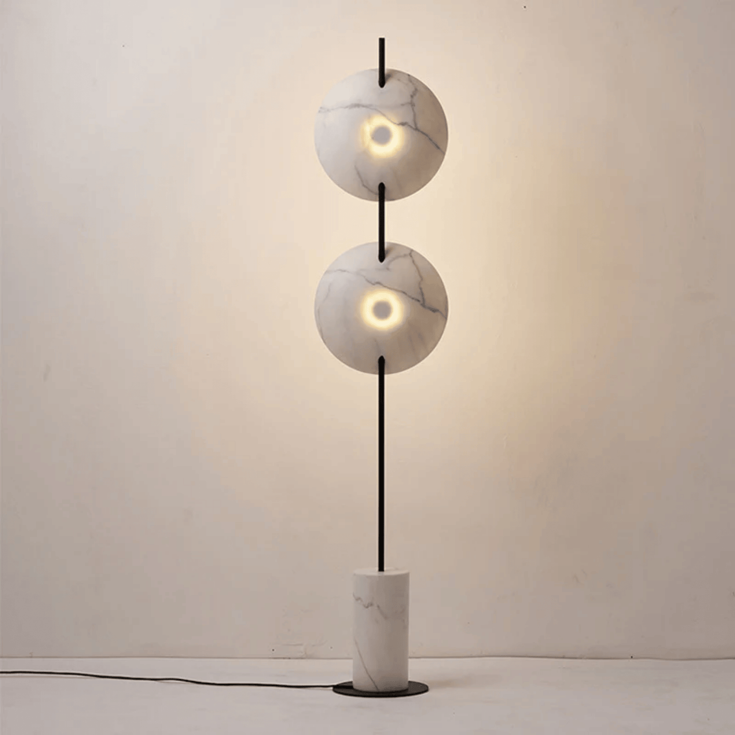 Modern floor lamp with marble-like design on a plain background