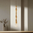 Pendant light with wooden beads and a light bulb on a white background