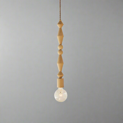 Pendant light with wooden beads and a light bulb on a white background