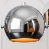 Modern pendant light with reflective surface and orange interior