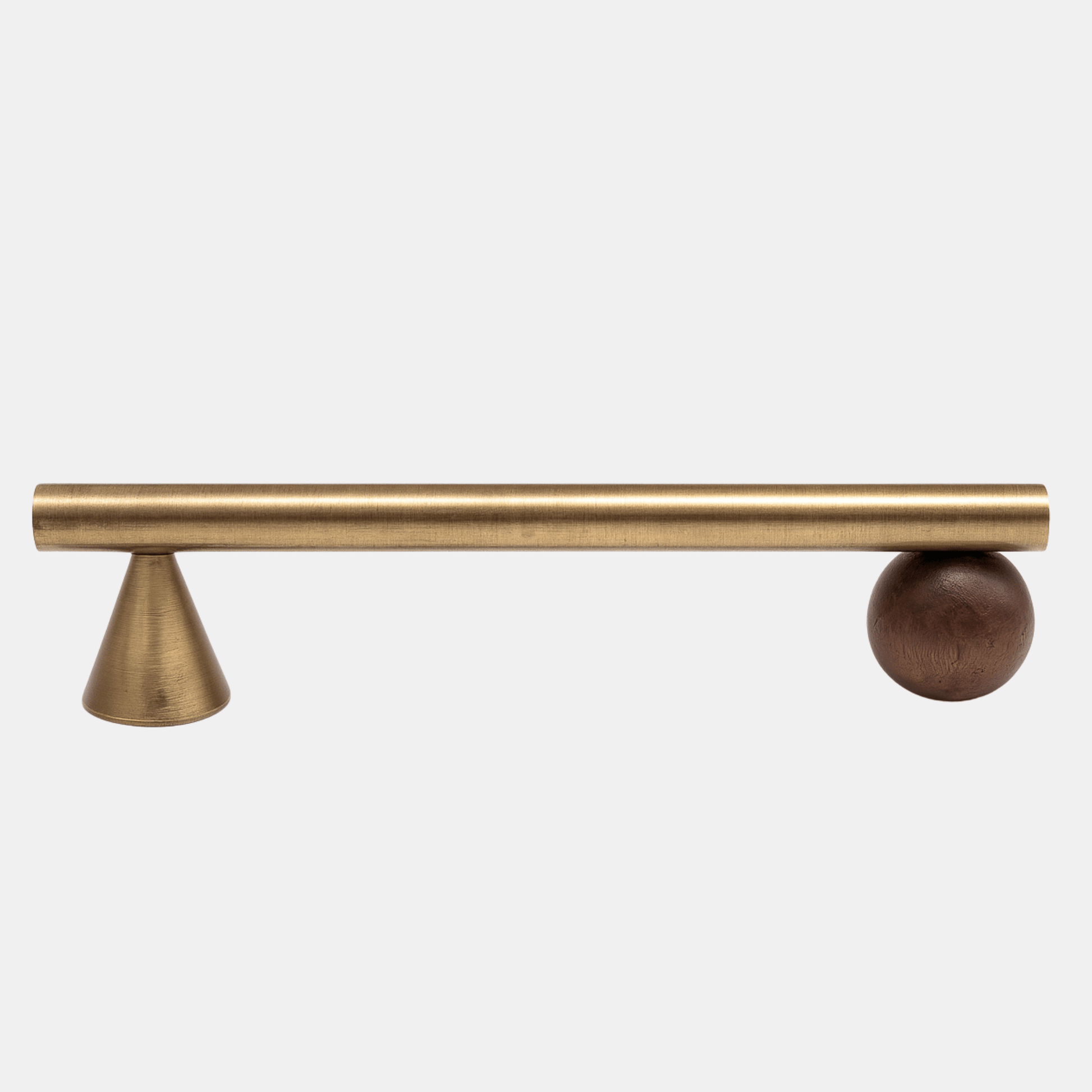 Brass cabinet handle with a wooden finial on a white background