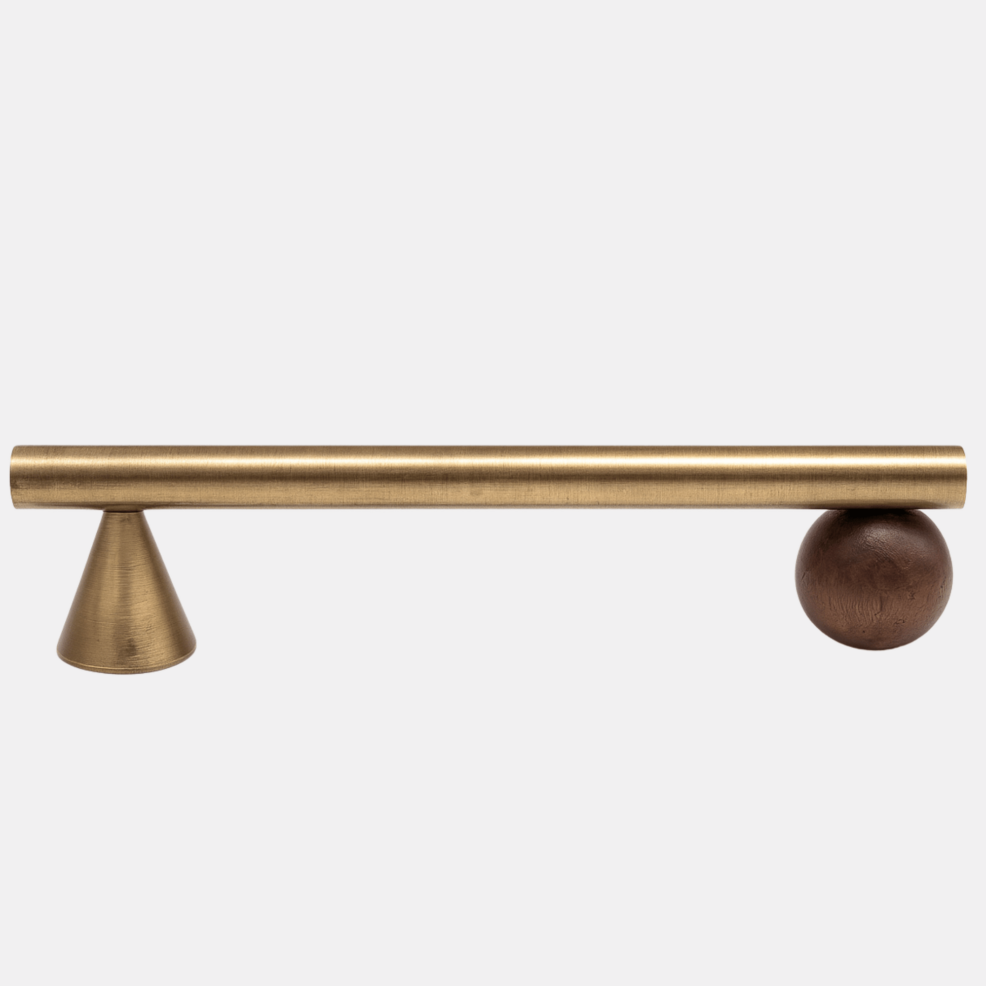 Brass cabinet handle with a spherical design on a white background