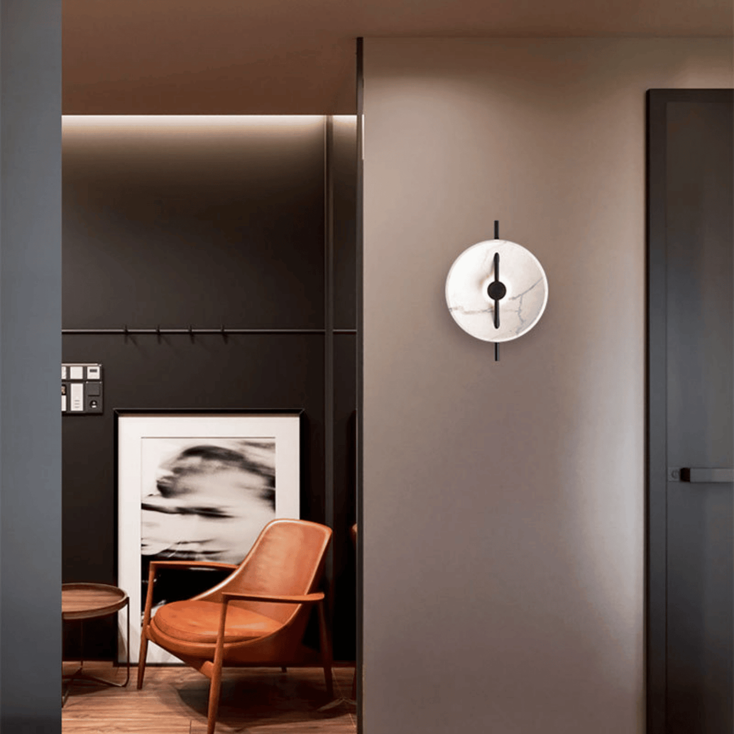 Modern interior design with a wall clock, chair, and artwork.