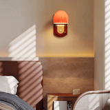 Wall-mounted lamp with a warm glow in a room setting