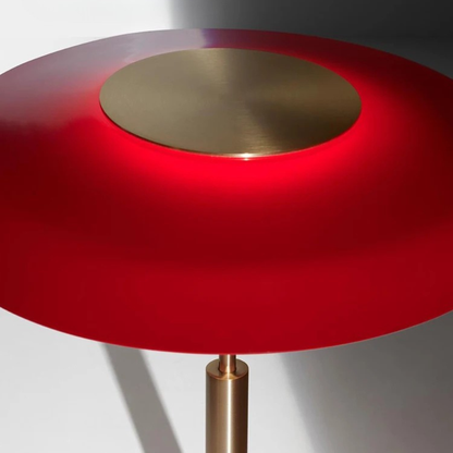 A top-down view of the red lamp, showing the inner glow of its shade.