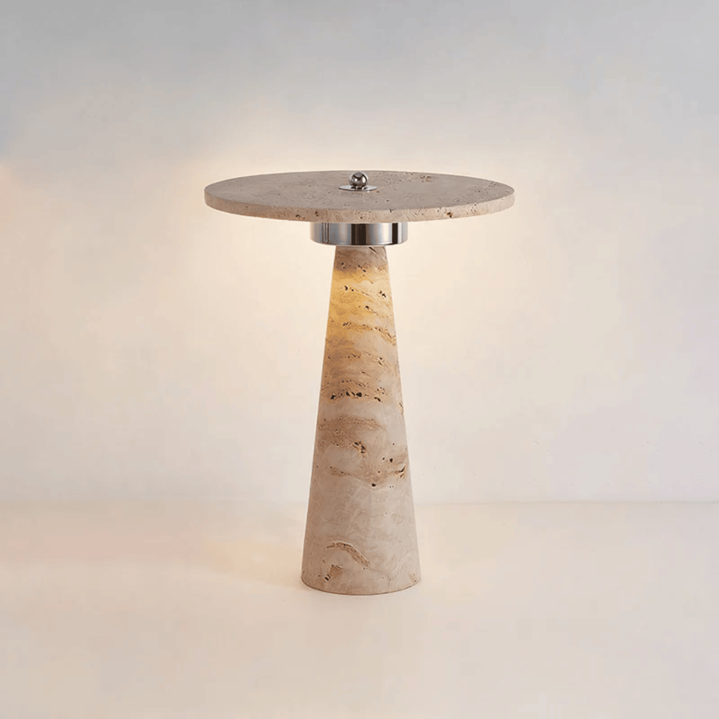 Table lamp with stone-like base and round top on a light background